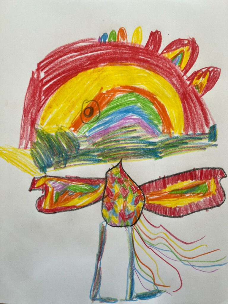 Auf dem Bild sieht man einen bunten Vogel, zur Geschichte "Der Regenbogenvogel".